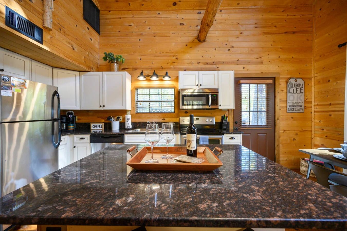 Enjoy the relaxing experience of sipping wine while preparing your meal in the comfortable and well-designed kitchen space.