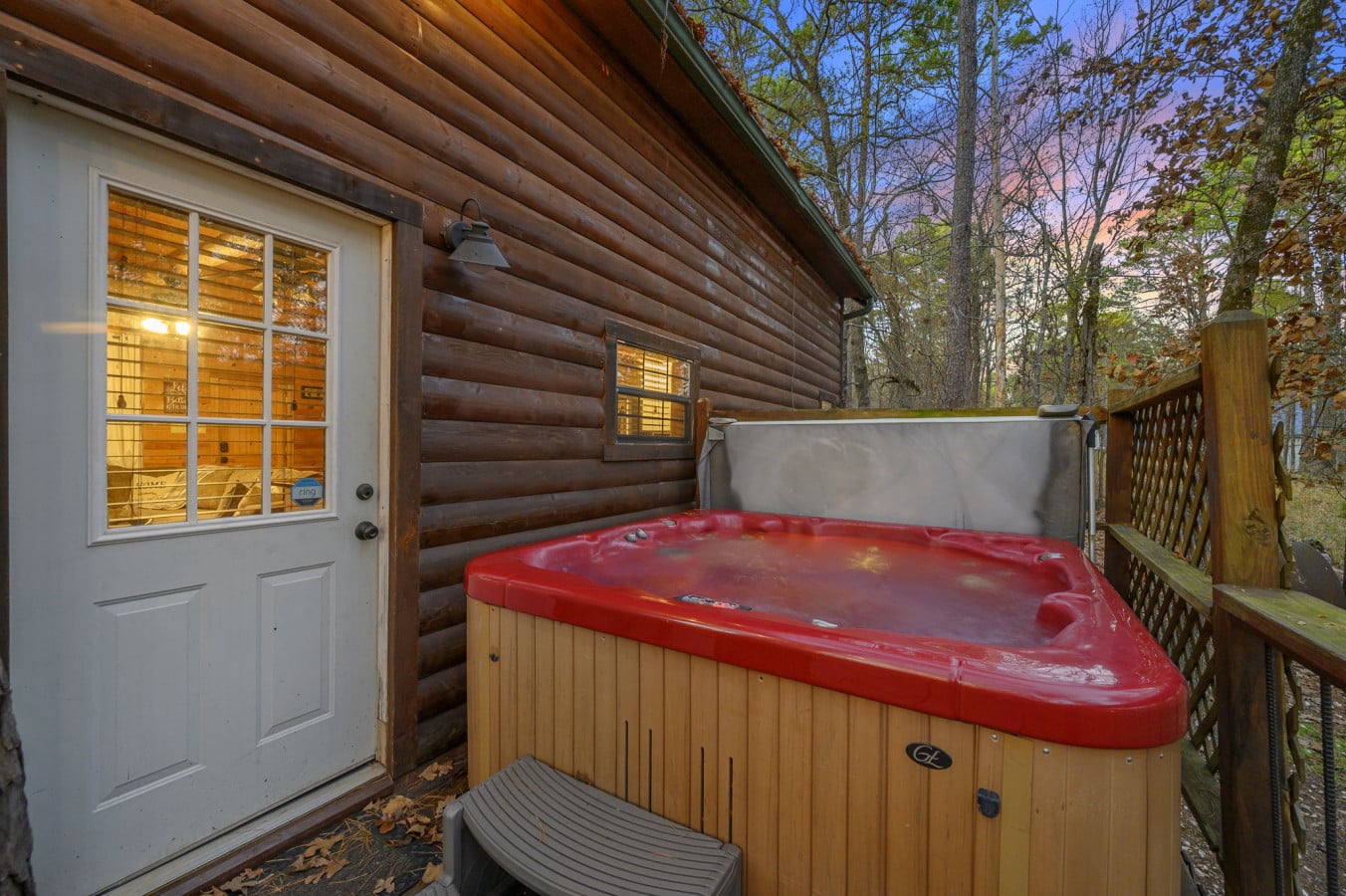 Relax in the hot tub and enjoy a soothing soak in a peaceful outdoor setting, perfect for unwinding after a long day.