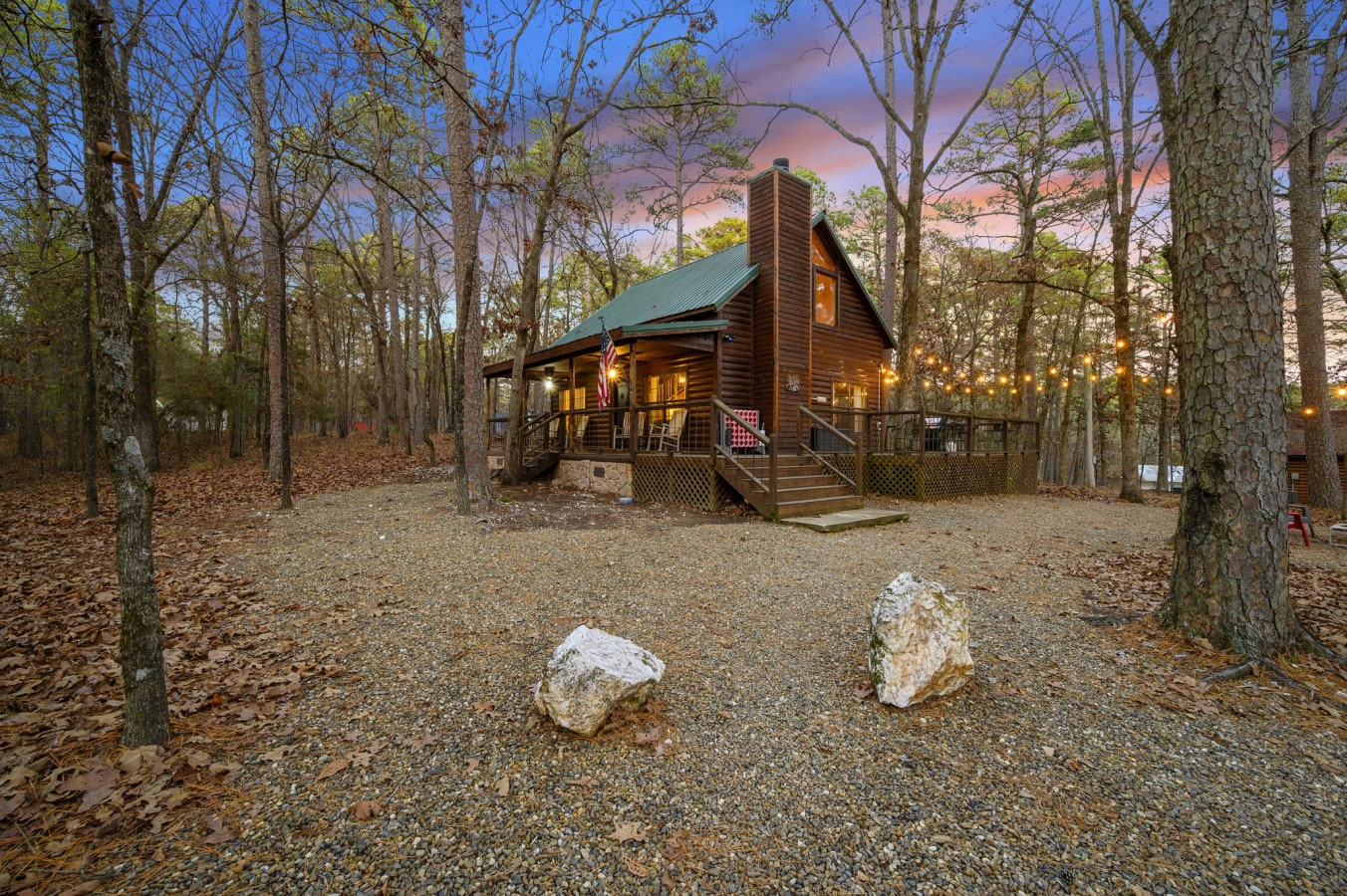 Side view of the property showcasing the homeu2019s exterior design, natural surroundings, and peaceful outdoor setting.