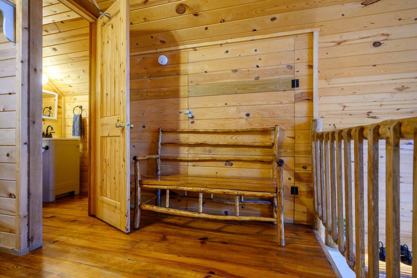 Comfortable wooden bench adding a natural, rustic touch, perfect for sitting, relaxing, or enjoying the surroundings.
