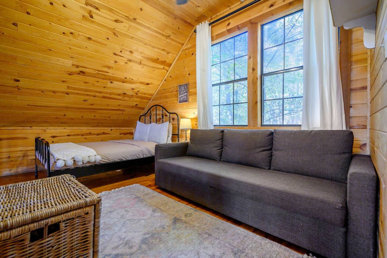 Large bedroom windows allowing natural sunlight to fill the room while offering beautiful outdoor views and a bright, airy atmosphere.