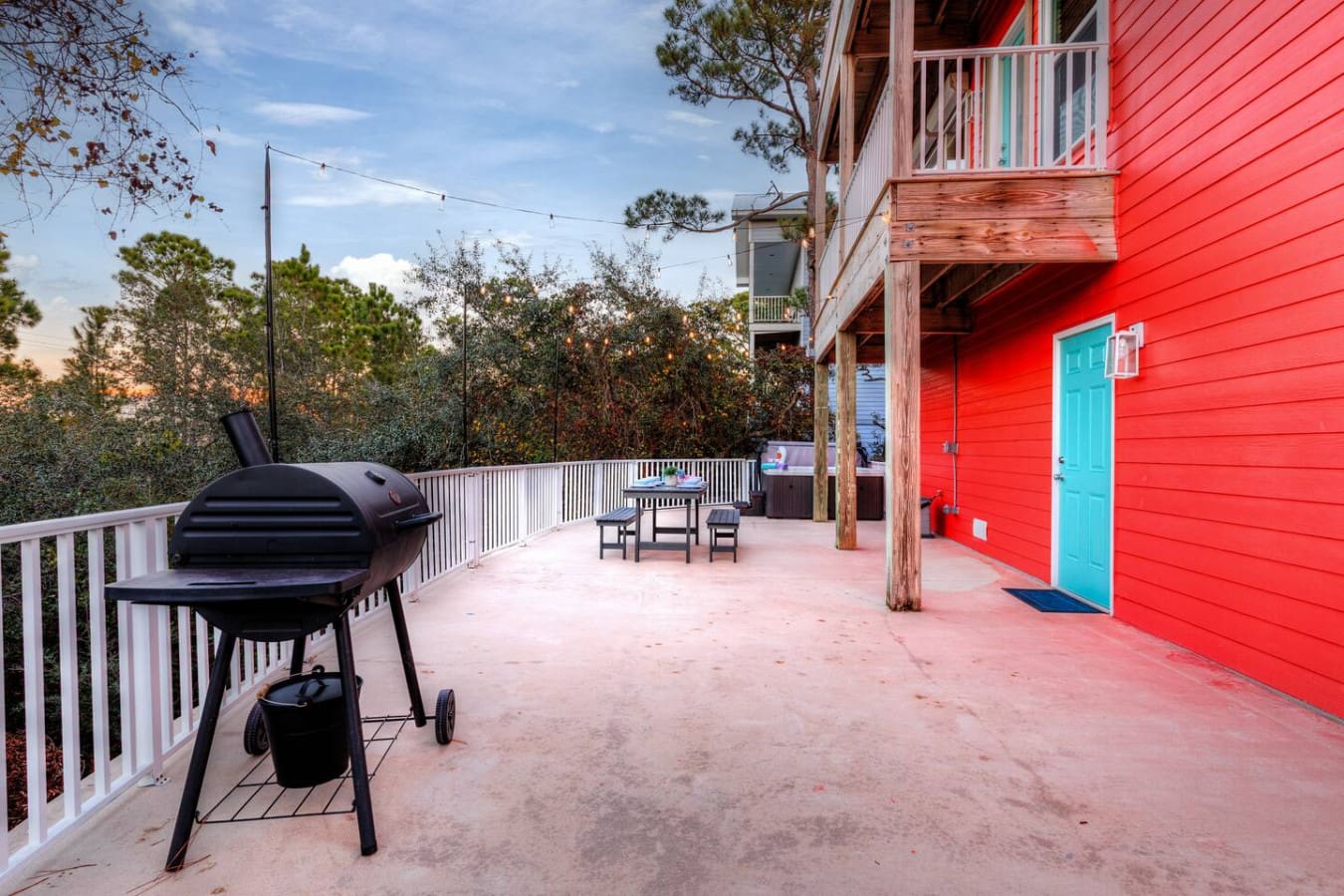 This elevated deck is basically your own private hangout spot with a killer grill, plenty of shade, and views of the whole colorful beach community stretching out in front of you.
