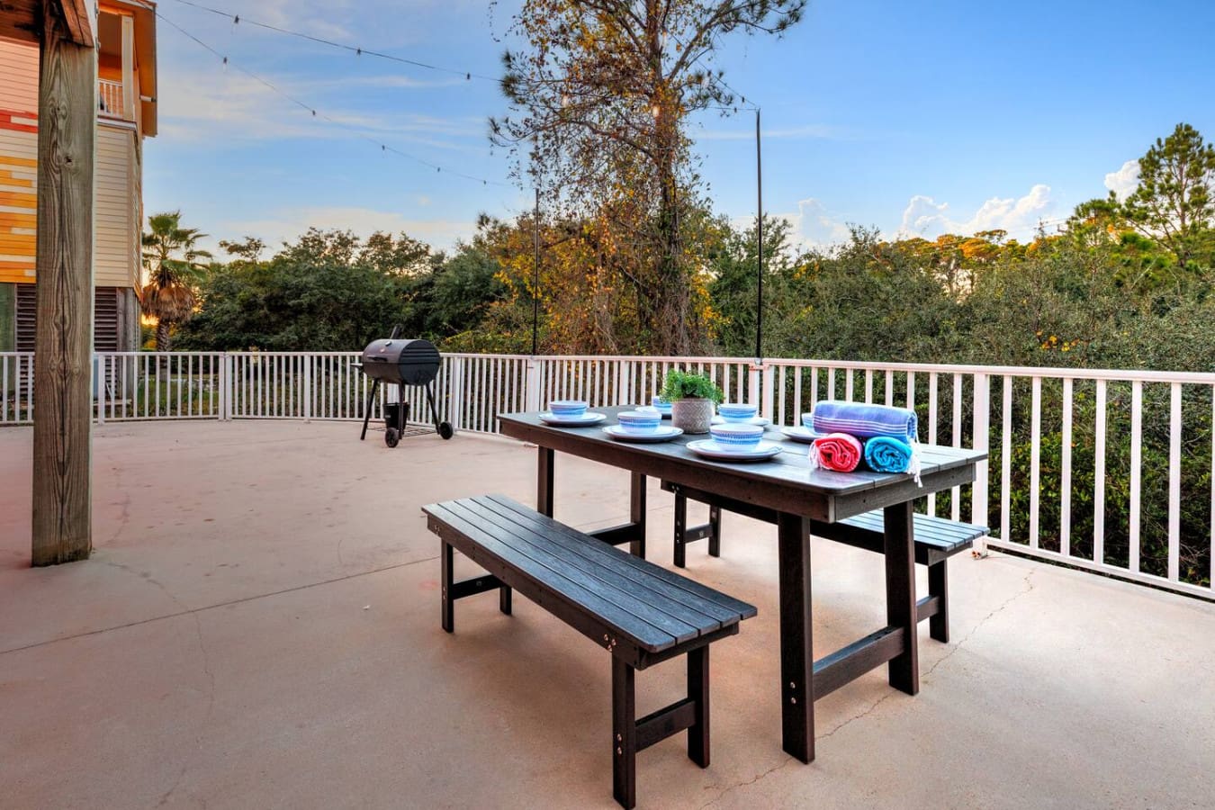 This spacious deck is basically made for gathering the whole crew around that picnic table with nothing but trees, sky, and that charcoal grill keeping you company all day long.