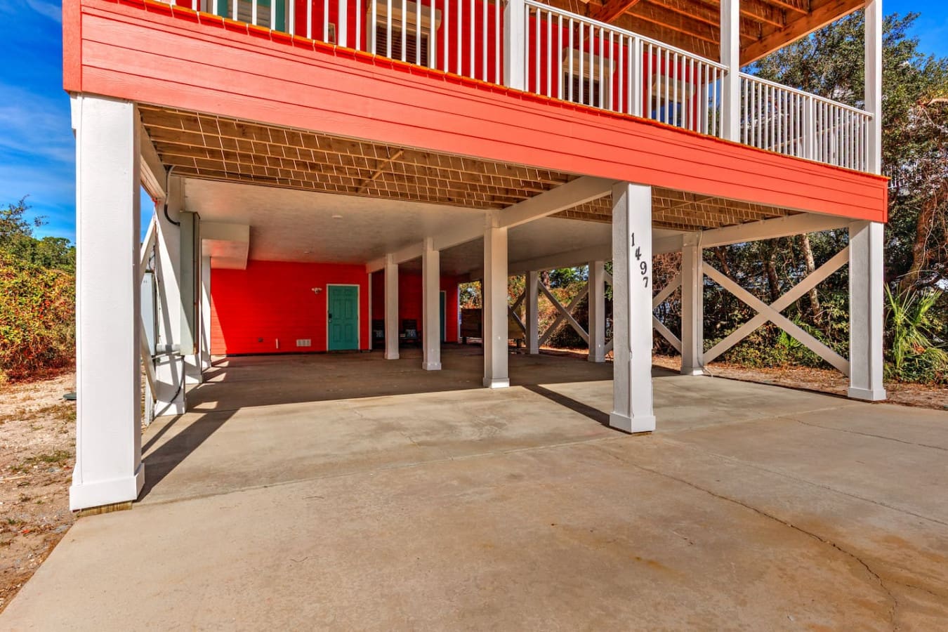 This covered carport and open-air living space is basically your personal slice of paradise—perfect for morning coffee, afternoon shade, or just hanging out while the coastal breeze does its thing.