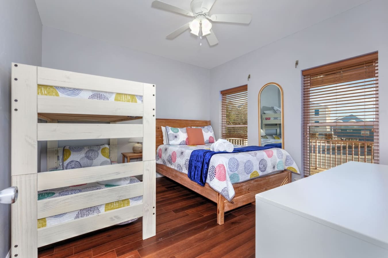 This spacious kids' bedroom has everything you need with two comfy beds, a fun patterned bedding mix, and plenty of room for the whole crew to spread out and relax.