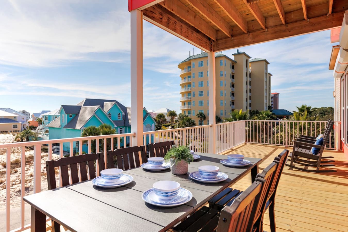Imagine gathering your crew on this sprawling deck with views of colorful beach houses and high-rise condos, all while that sweet coastal breeze flows through your covered pergola.