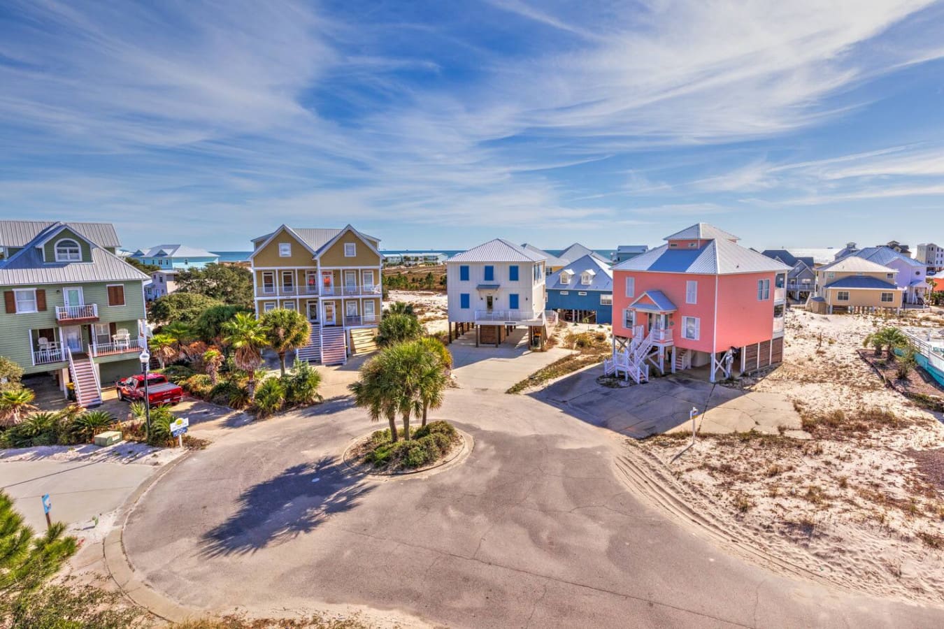 These charming pastel beach houses all lined up together make you feel like you've stepped into a little coastal village where every neighbor has the best view in town.