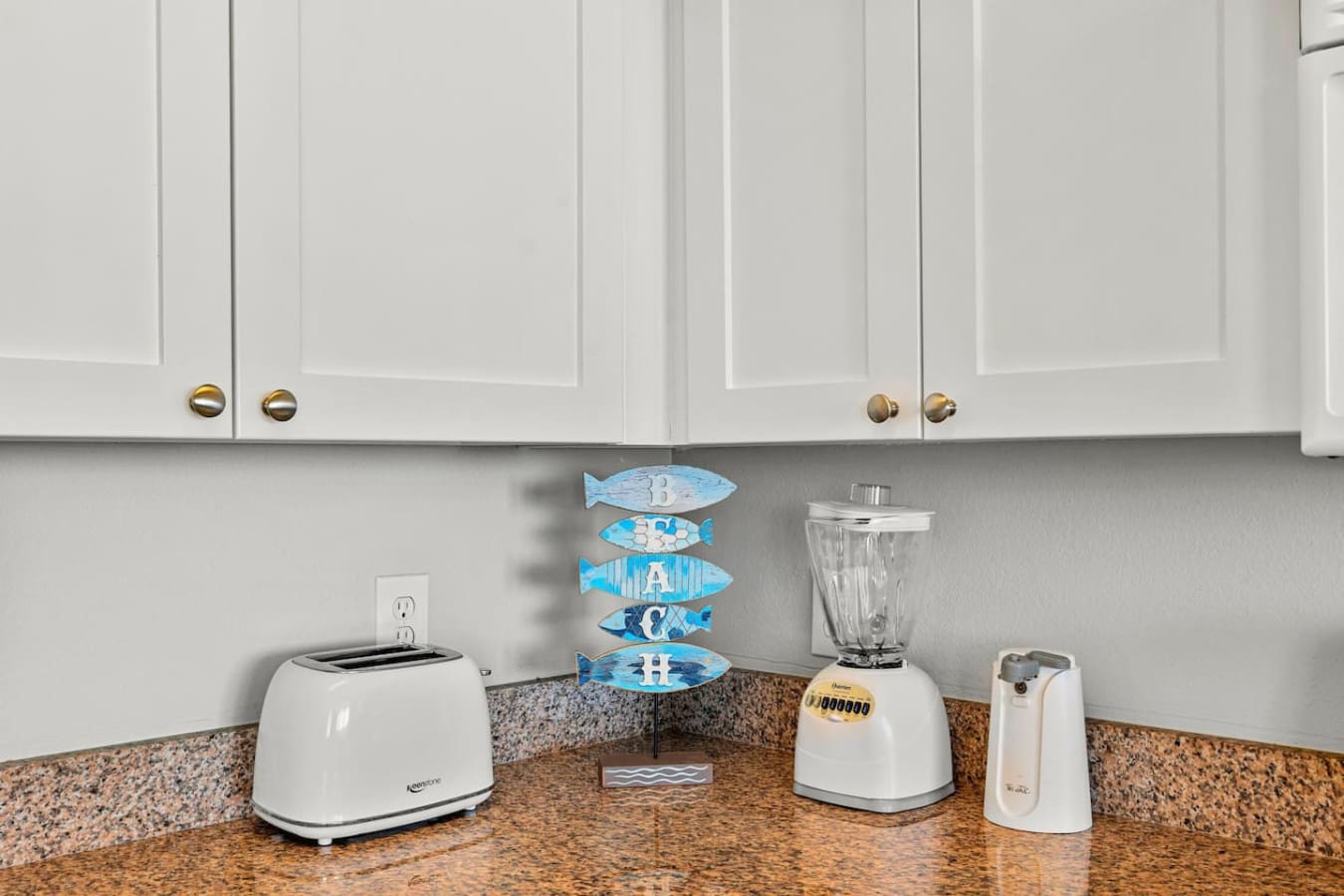The kitchen appliances are all lined up and ready to go—just grab what you need and get back to what really matters, which is basically everything happening out on that beach.