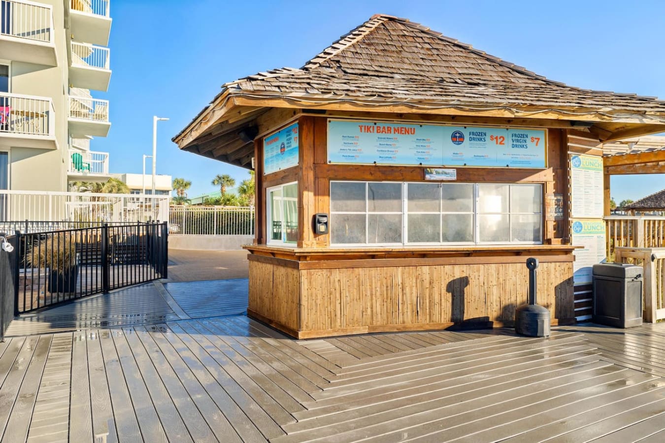 The beachfront boardwalk at Pelican Beach Resort is your playground—grab a bite, soak up the sun, and feel that salt air while you're just steps from the sand.