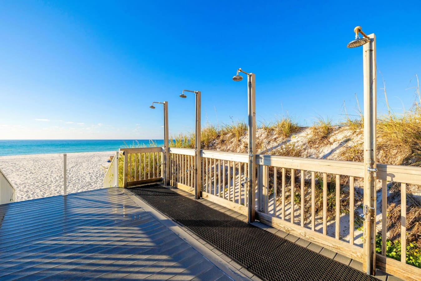 Wake up to outdoor showers that overlook the dunes and ocean—there's something about rinsing off under open sky that makes you feel like you're part of the beach itself.