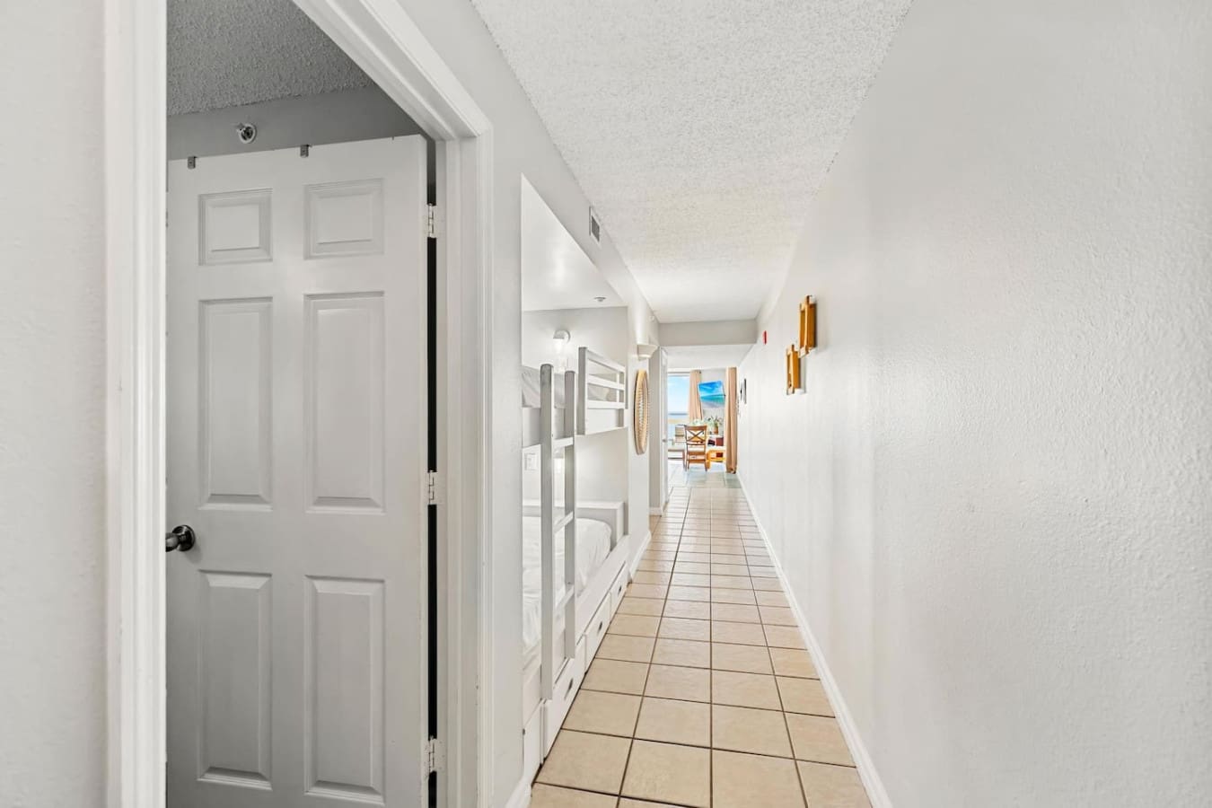 This pristine hallway is basically the quiet throughway that connects all your beach vacation moments—from cozy bedroom retreats to the main living spaces where the real ocean views take over.