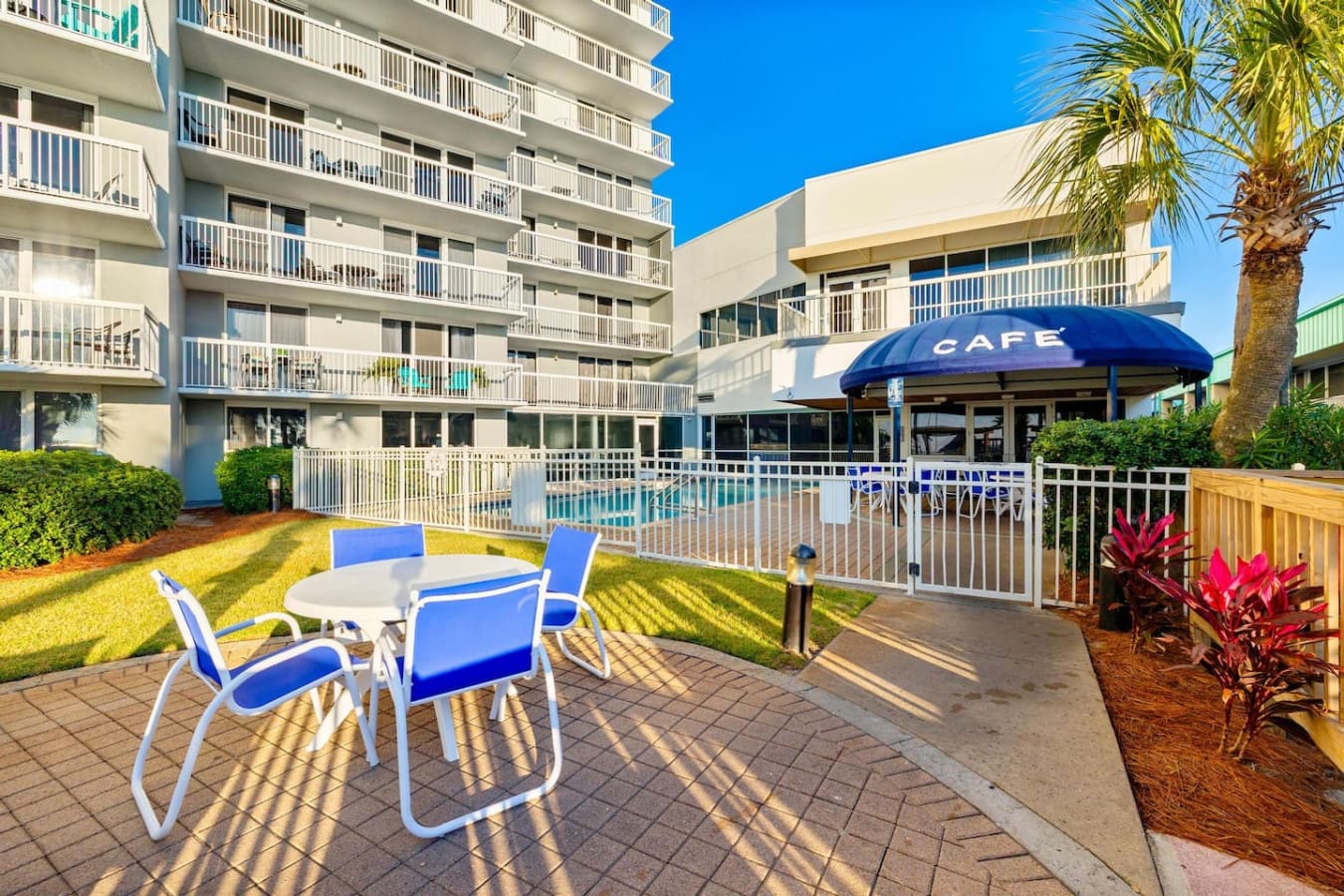 The beachfront lawn at Pelican Beach Resort is your own little slice of paradise—kick back in a lounger, feel the grass under your feet, and soak in that perfect blend of relaxation where the resort, pool, and ocean all come together in one spot.