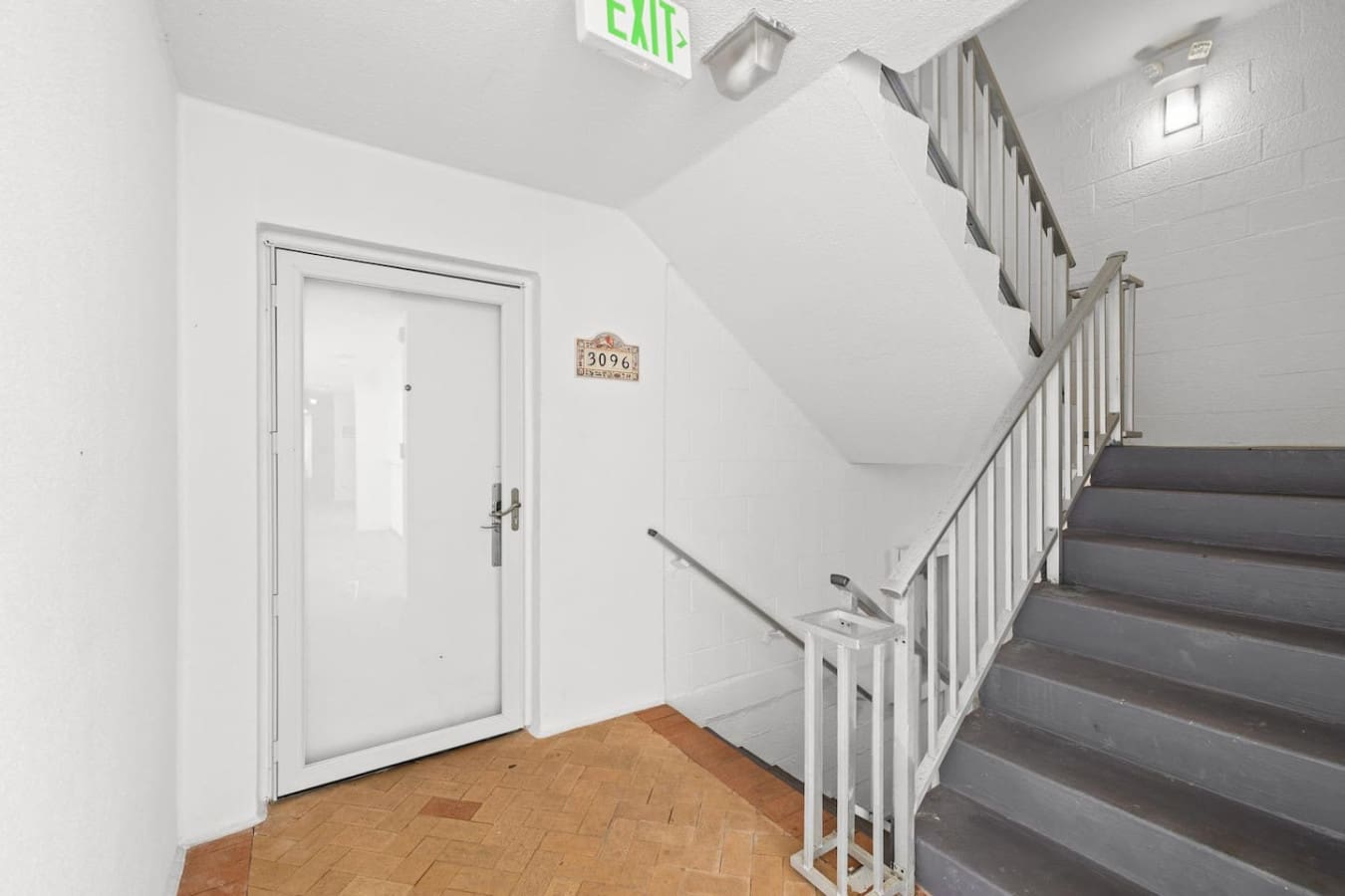Staircase providing easy access between levels, designed for convenience and smooth movement throughout the property.
