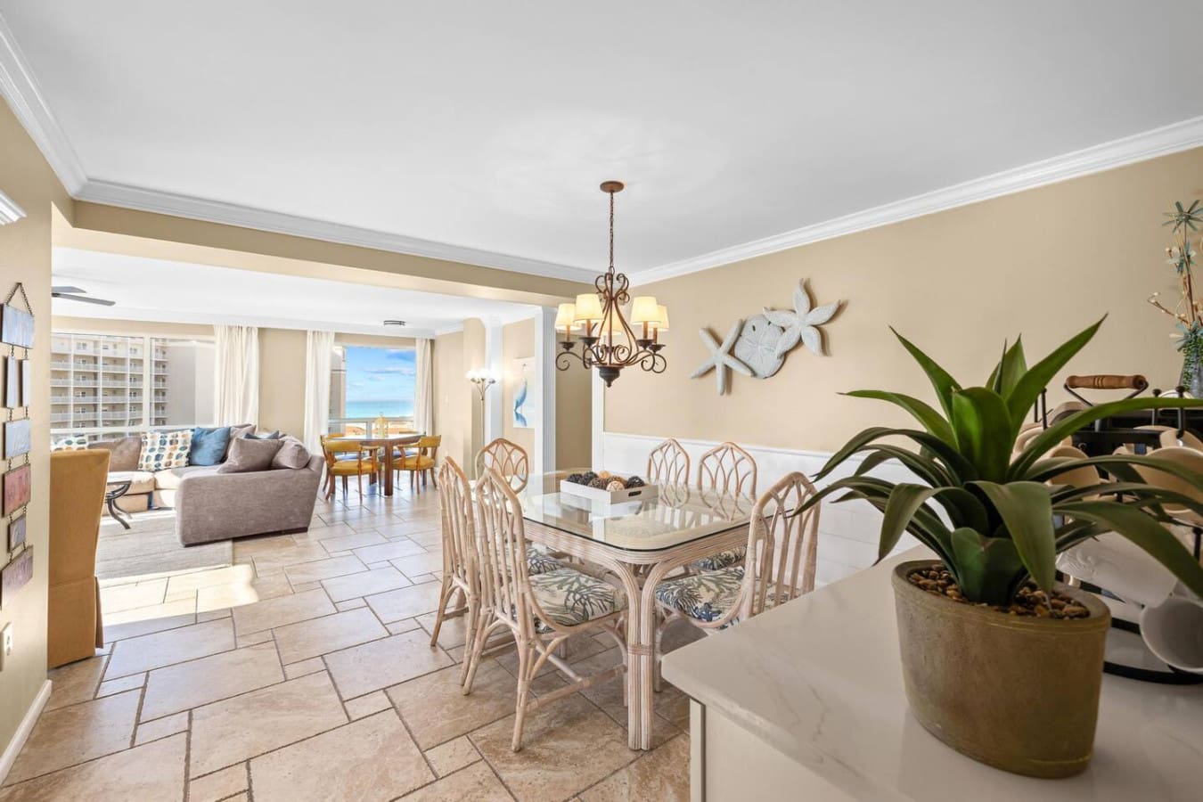 Decorative plants and coastal-inspired design elements that enhance the natural, relaxing, and beachside atmosphere of the space.