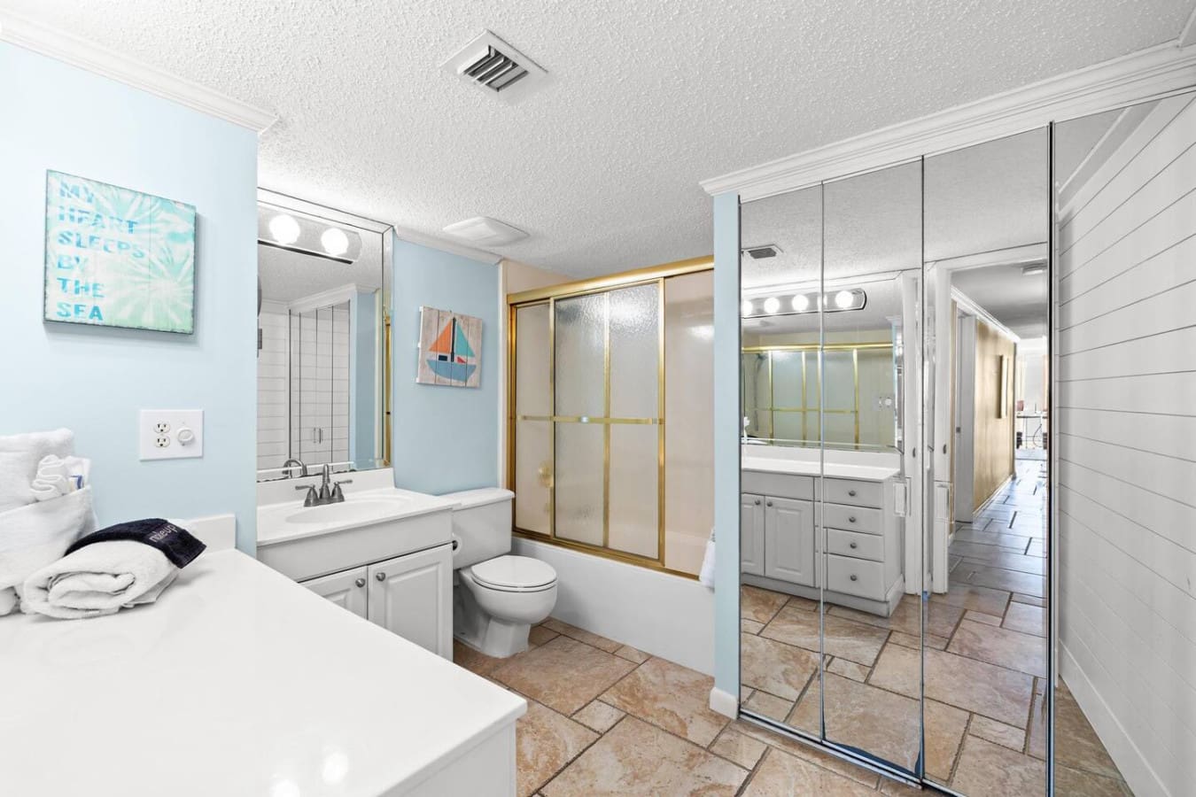 Elegant glass shower enclosure adding a modern touch, providing a clean and comfortable bathing experience.