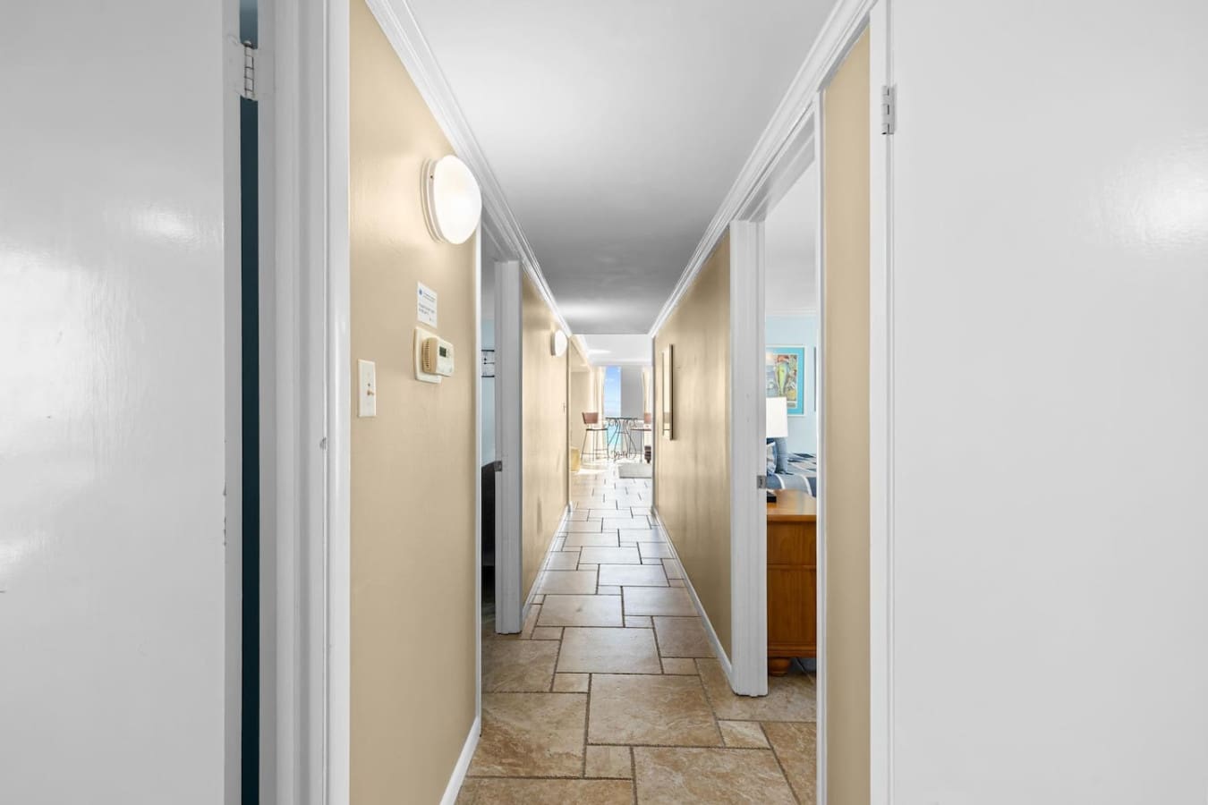 Clean and well-lit hallway providing easy movement between rooms and spaces within the property.
