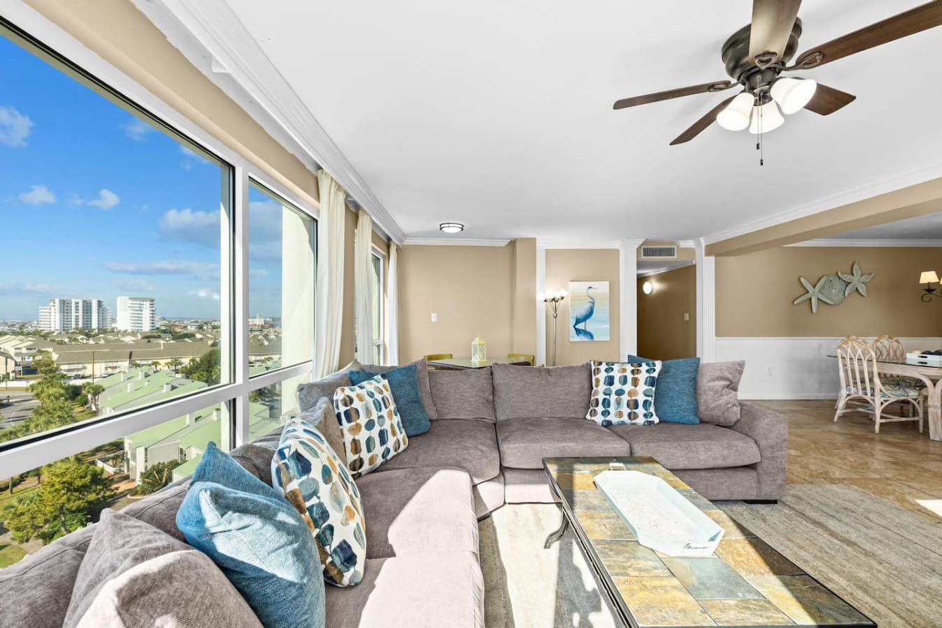 Bright and airy space featuring large windows that allow natural sunlight to fill the room while offering beautiful outdoor views.