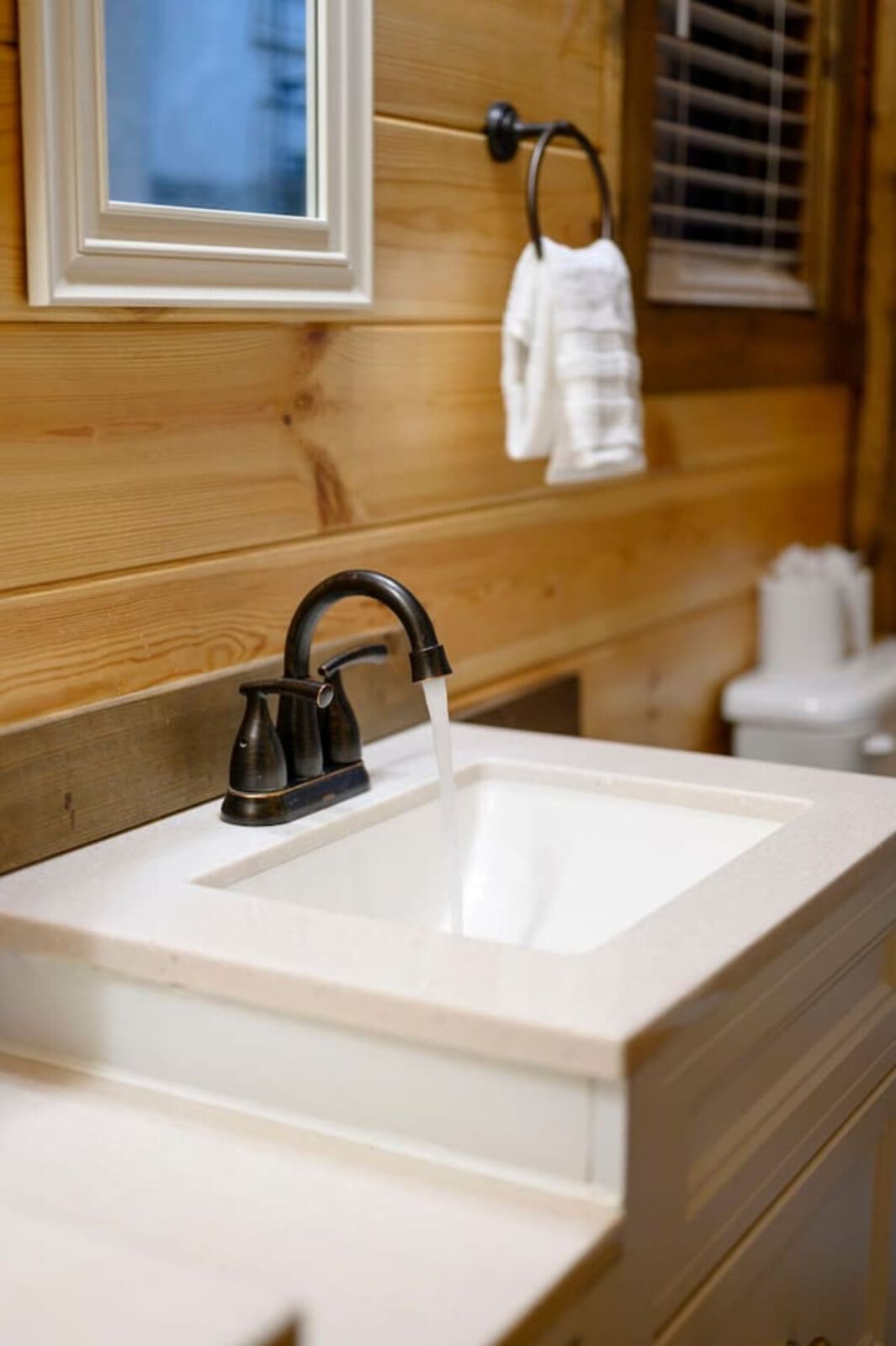 Nothing about this image warrants a caption for a luxury vacation rental, as it shows a standard bathroom sink with no distinctive features, views, or luxury amenities visible.