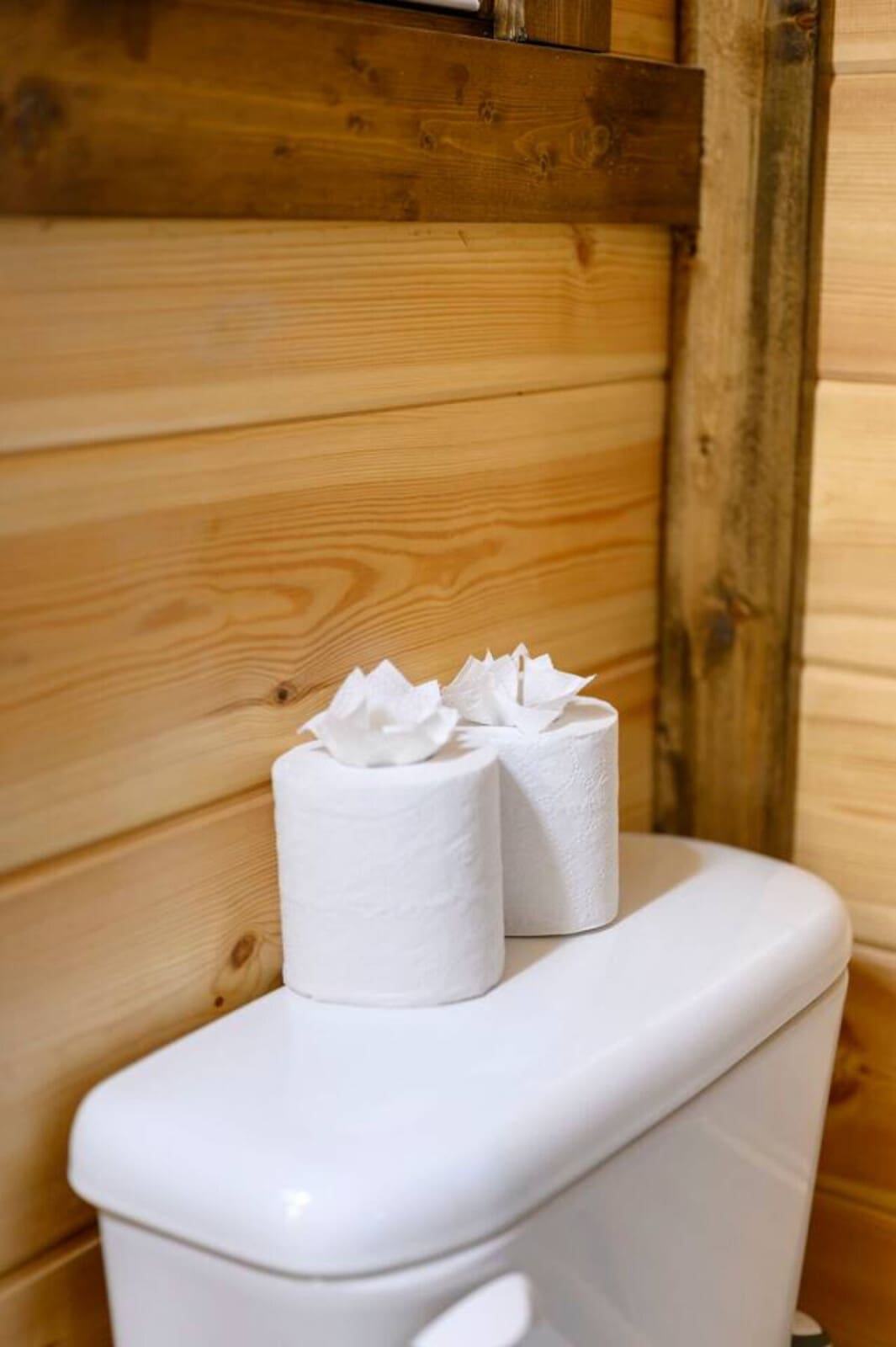 Rustic wooden bathroom with thoughtful touches in our cozy cabin retreat.