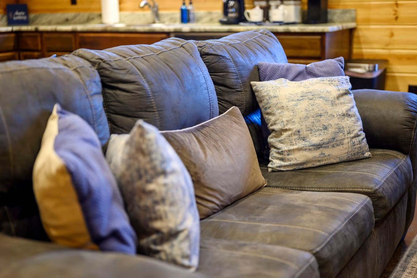Sink into this gorgeous leather sectional and get cozy with all the pillows you could want.
