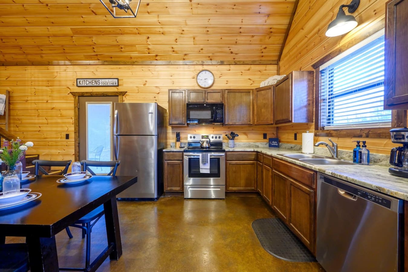 This fully equipped kitchen features stainless steel appliances, granite countertops, and plenty of space for group cooking.