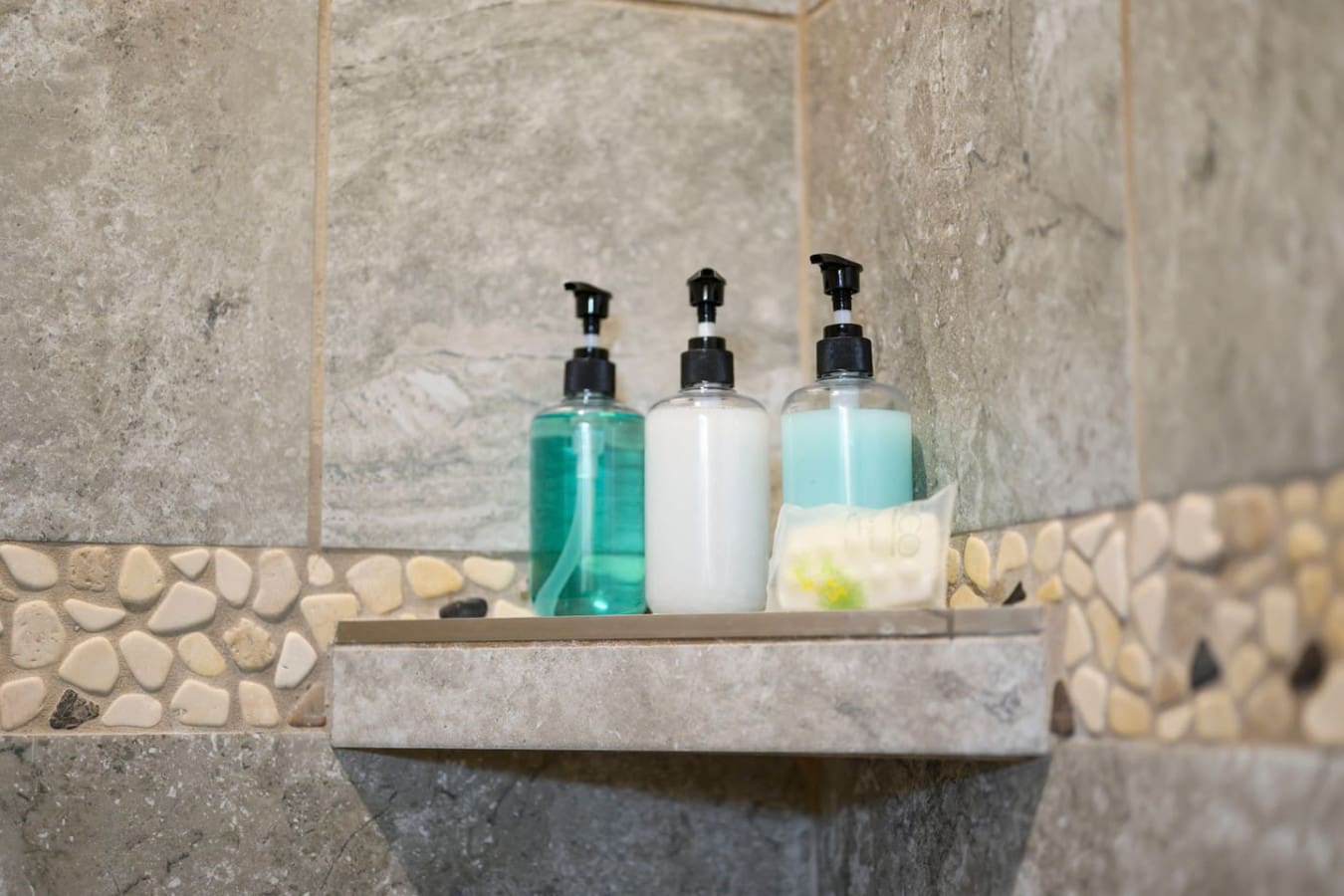 Spa-quality bathroom amenities and thoughtful touches make every shower feel like a resort experience.