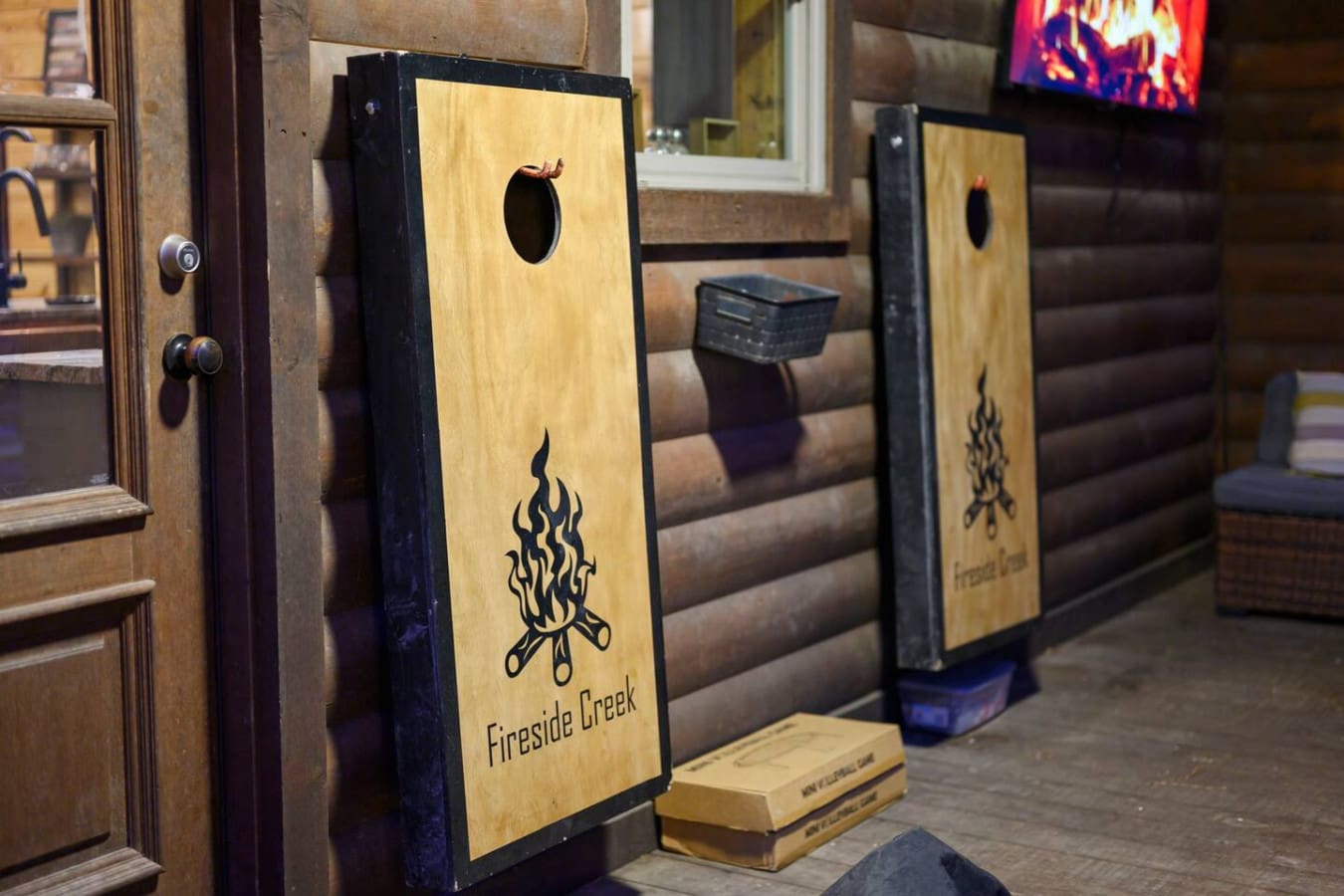 Our guests love challenging each other to cornhole tournaments right here by the fireplace lounge.