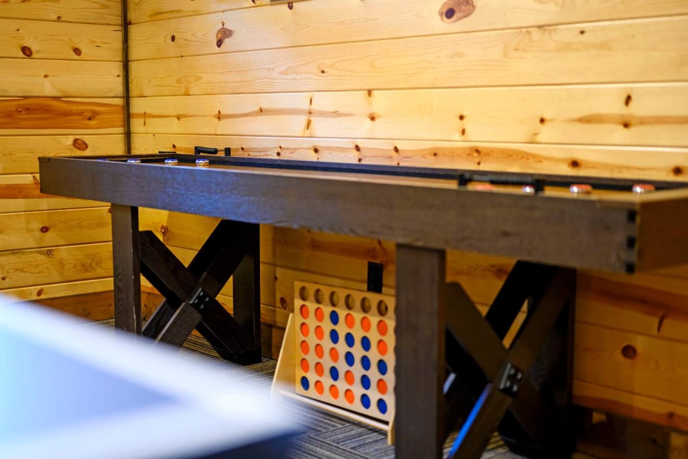 This cozy cabin's game room has everything you need for a fun night in with family and friends.