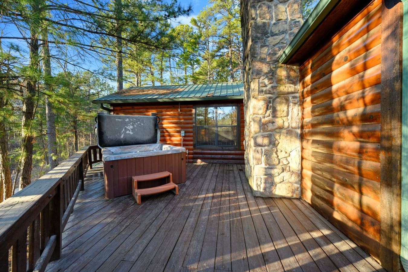 Soak in your private hot tub on this expansive deck surrounded by towering pines and forest views.