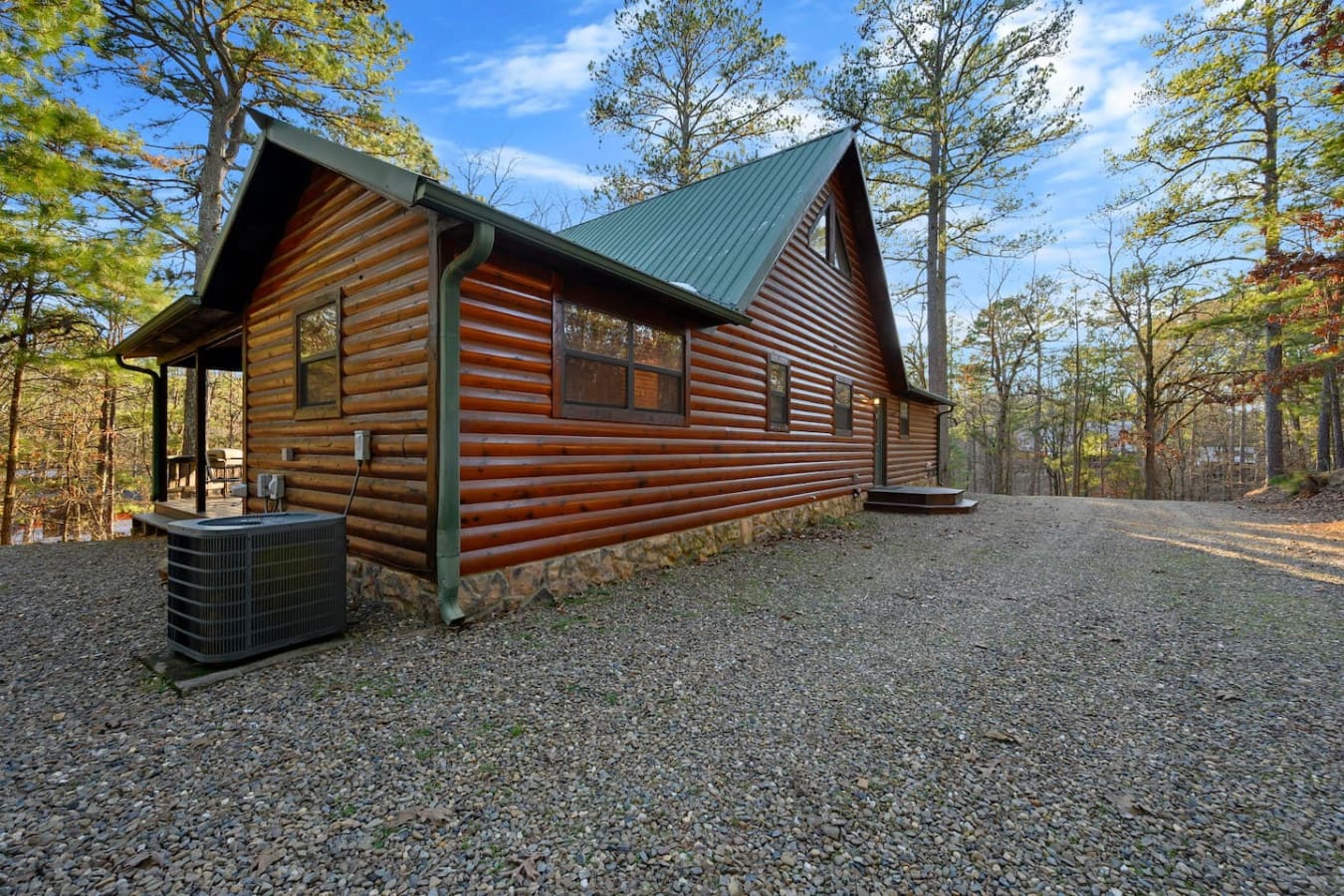 This gorgeous log cabin sits nestled in the woods with modern finishes and plenty of space to spread out.