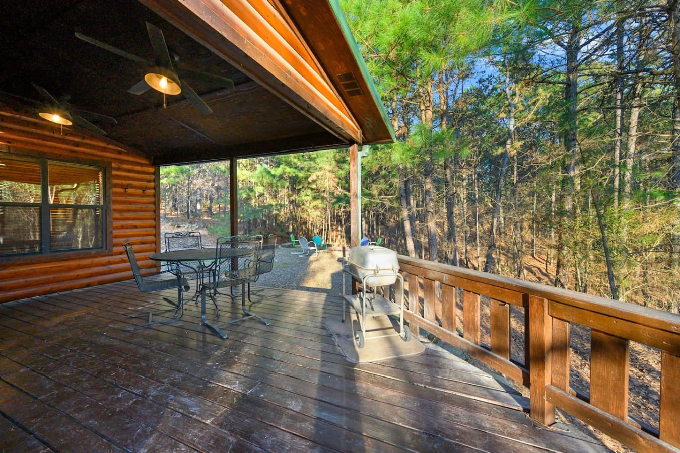 This covered deck is basically your own private forest hangout with plenty of space to relax and take in the trees.