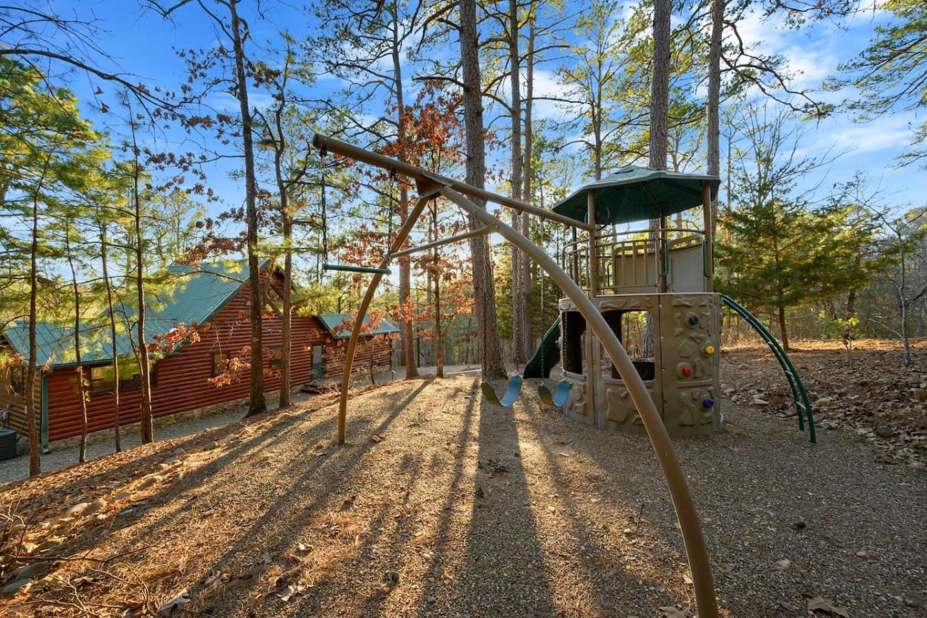 This property sits on a gorgeous wooded lot with a playground structure perfect for keeping the kids entertained.