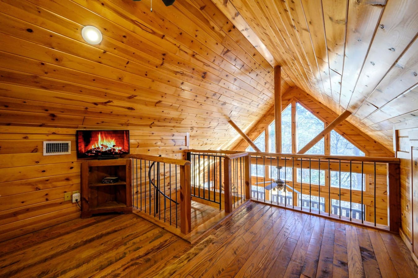 This cozy loft has everything you need to chill out—a fireplace, a TV, and those views that just don't quit.