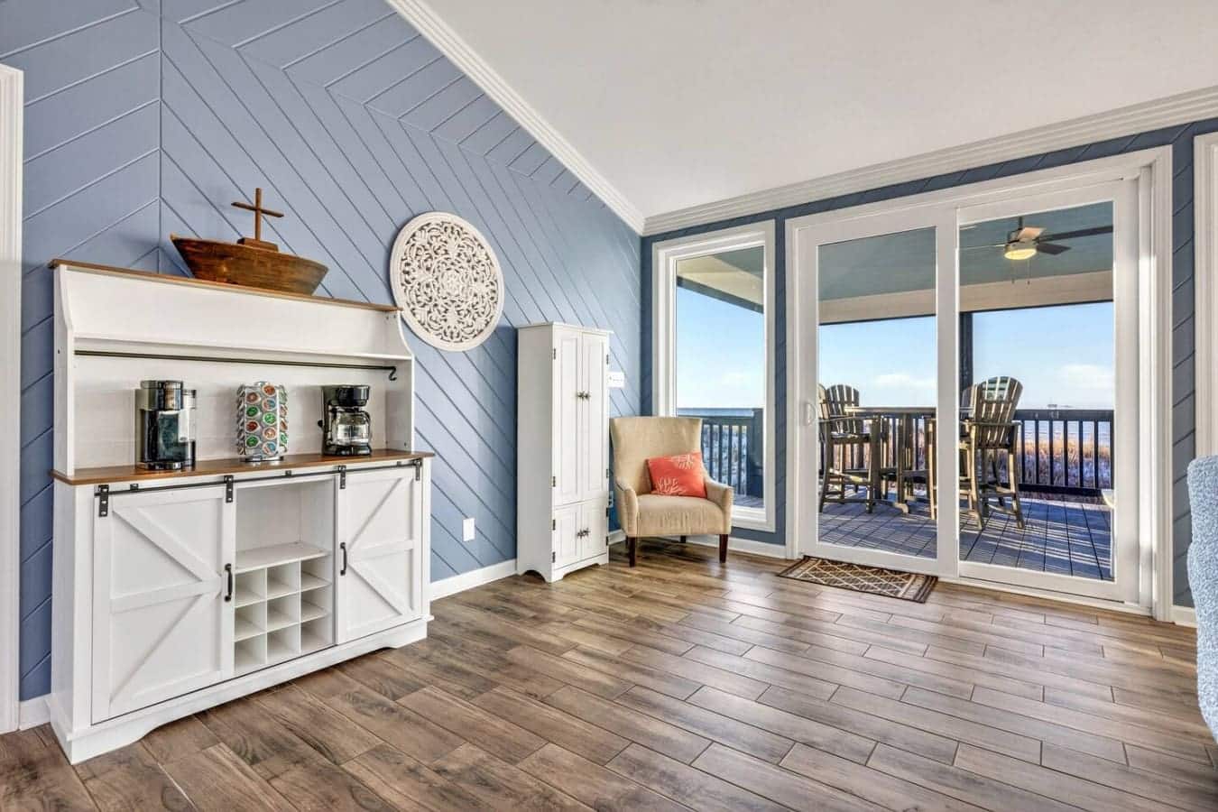 Wake up to endless ocean views from your private deck with direct access to this light-filled bedroom suite.