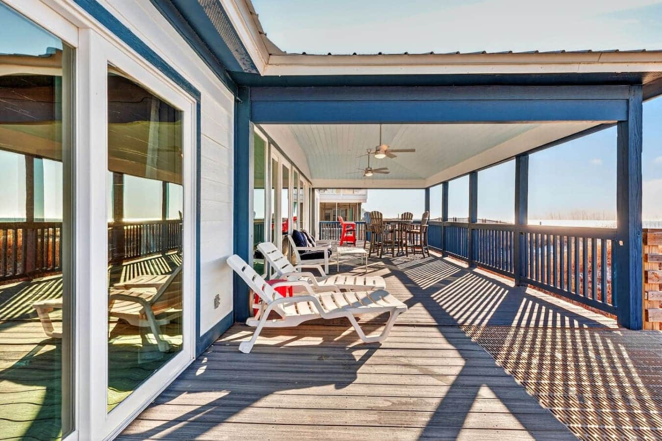 This massive covered deck is basically an outdoor living room with endless sky views and room for the whole crew.