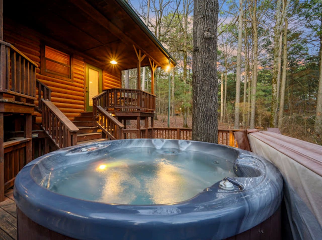 Soak under the stars in your private hot tub surrounded by towering forest trees and mountain views.