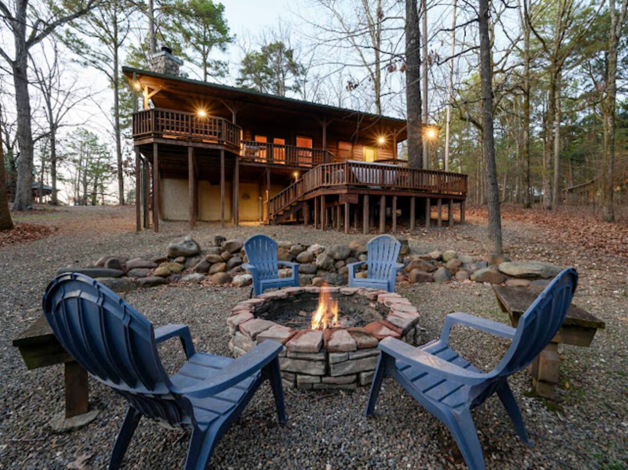 Cozy nights by the fire pit with this gorgeous timber cabin tucked into the peaceful woods.