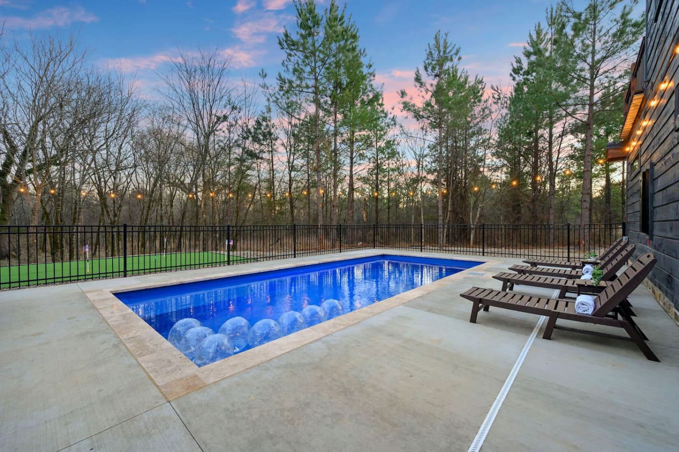 Nothing beats an evening swim with this gorgeous forest backdrop and those cozy lounge chairs waiting for you.