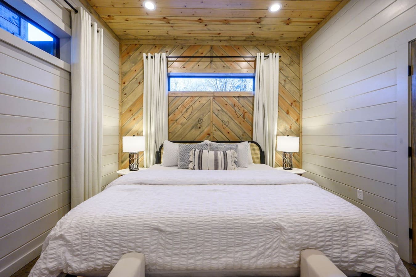 Wake up in this gorgeous canopy bed with soaring wood ceilings and those sweet views of the trees outside.