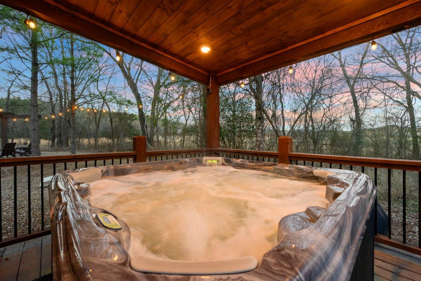 This covered hot tub overlooking the wooded valley is basically the perfect spot to unwind after a long day.