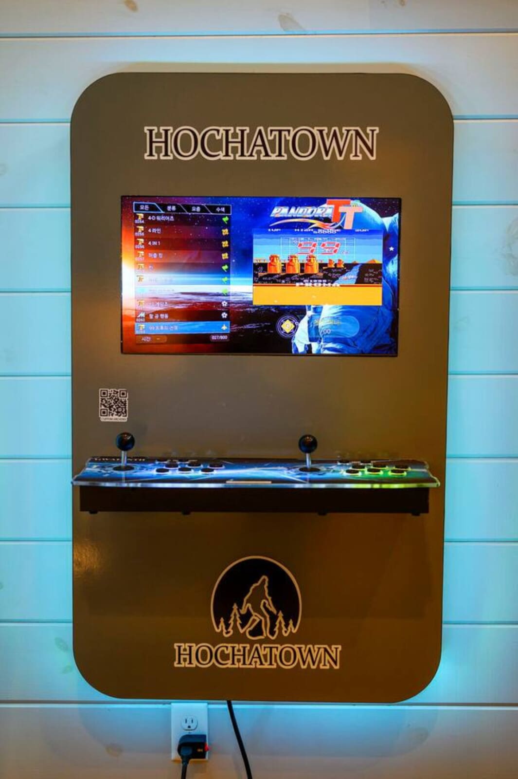 This place has a sick arcade game built right into the wall for keeping guests entertained.