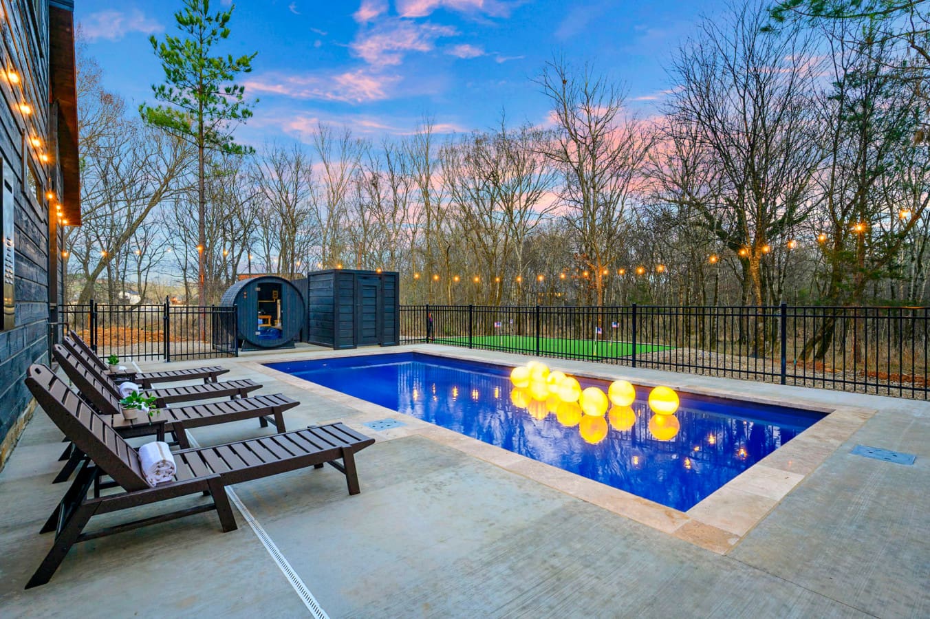 Your own resort-style backyard with an heated pool, lounge chairs, and those magical tree views at sunset.