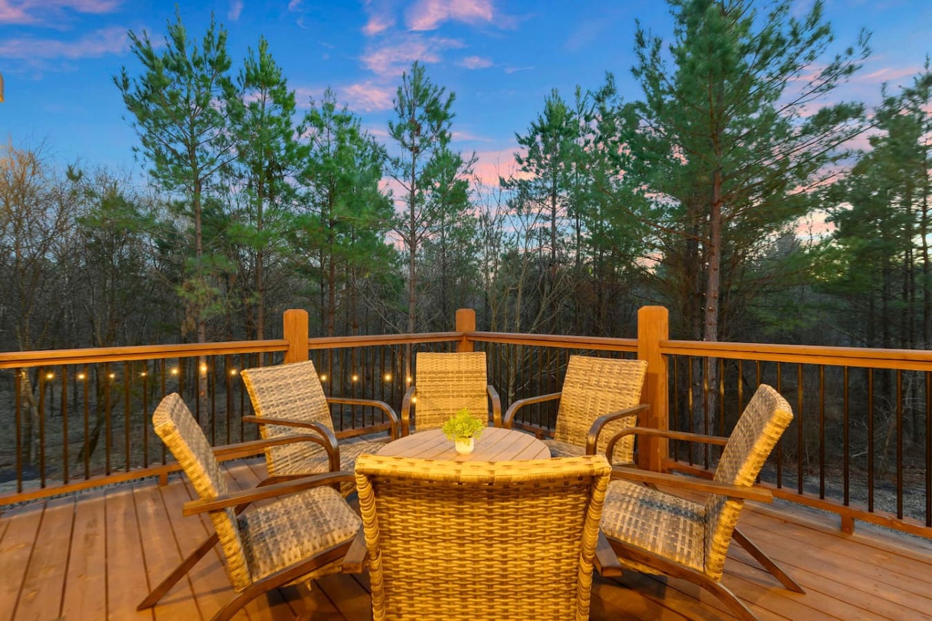 Enjoy your morning coffee on this stunning deck with panoramic forest views and cozy seating for the whole crew.