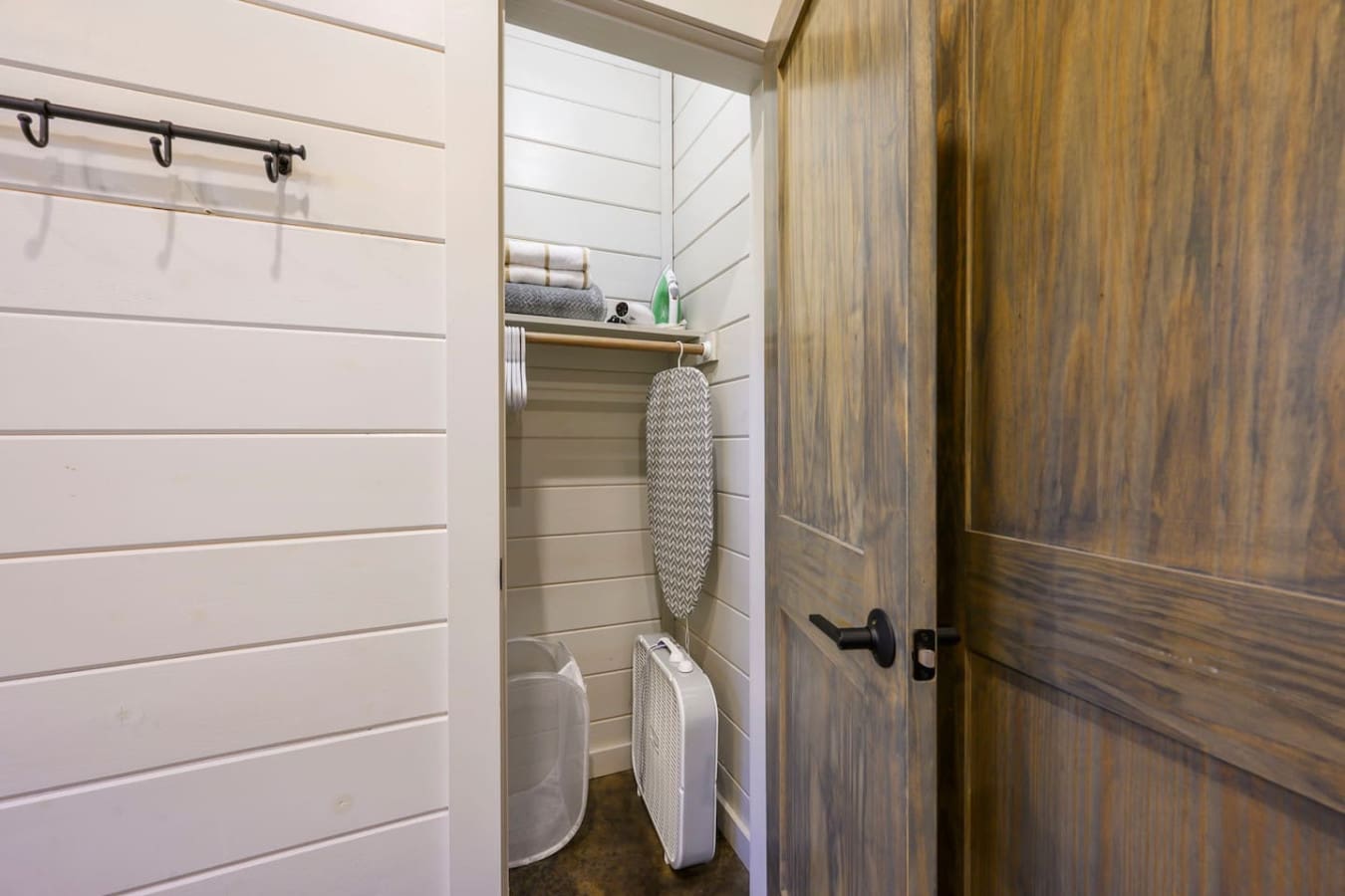 Dedicated laundry closet with full-size washer and dryer for extended stays.