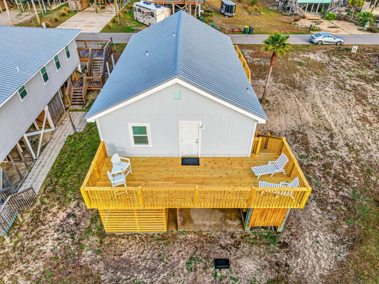 Bright and beachy with that perfect elevated deck for sunrise coffee and ocean views.