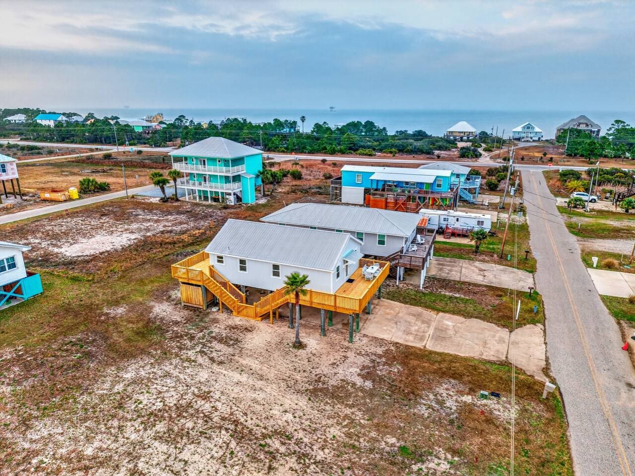 Beachfront community with elevated homes offering ocean views and that perfect coastal getaway vibe.