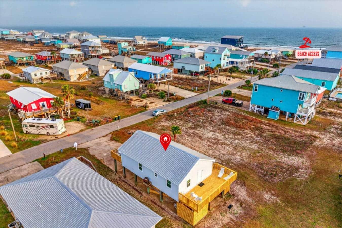 Beachfront community of colorful elevated homes with direct ocean views and sandy beaches just steps away.