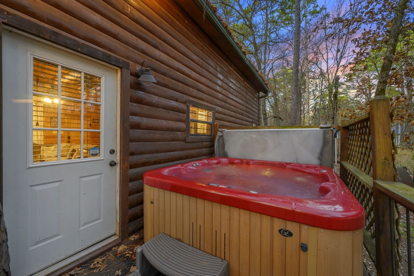 Relax in the hot tub and enjoy a soothing soak in a peaceful outdoor setting, perfect for unwinding after a long day.