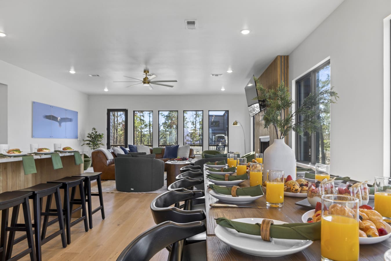 Long dining table, living room right there waiting — this space was made for the whole group.