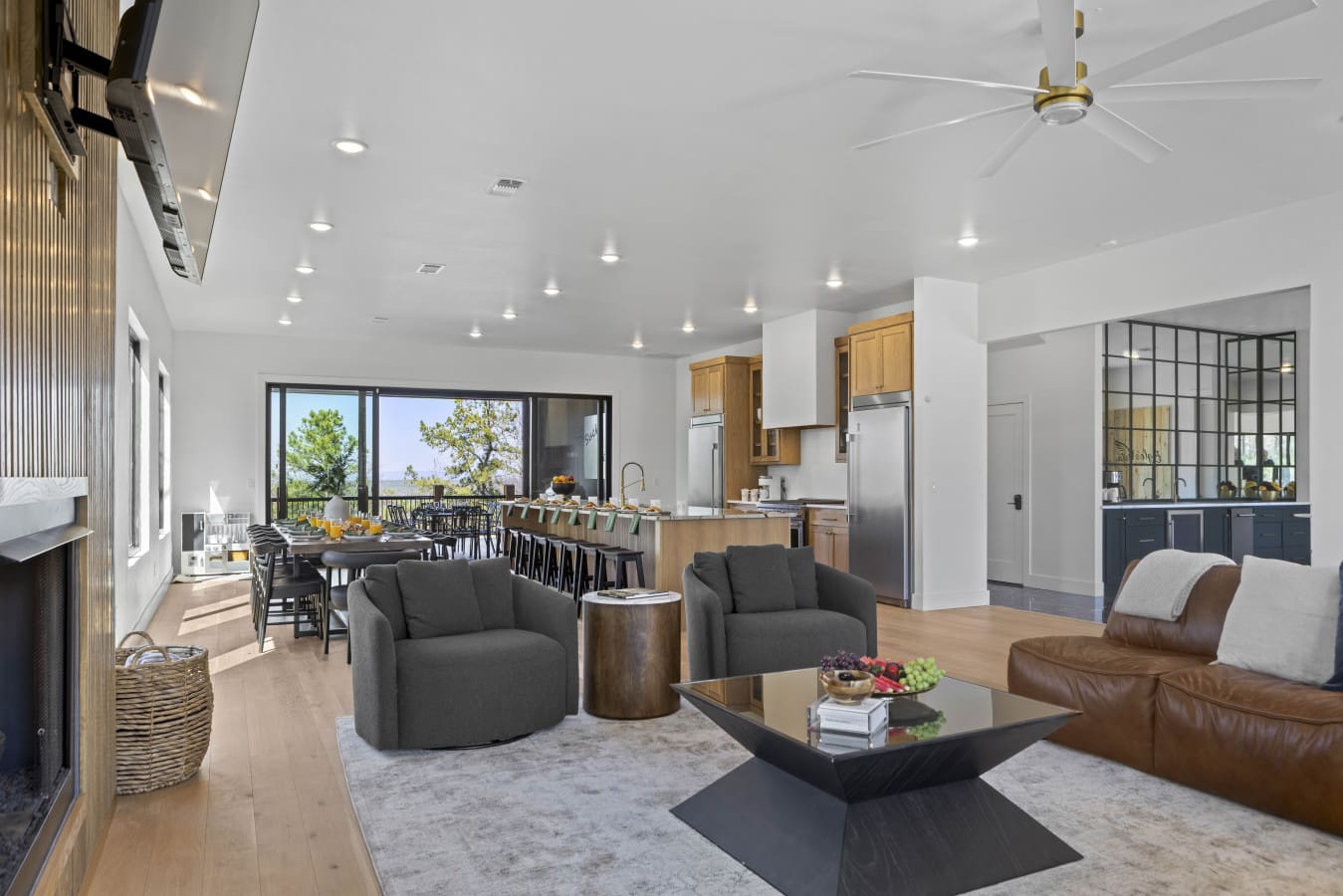 Open living room flows right into the kitchen and bar seating — everyone ends up in here.